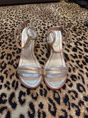 Leather Metallic Gold Ankle Strap Sandals with cool wooden heel
By Bernardo